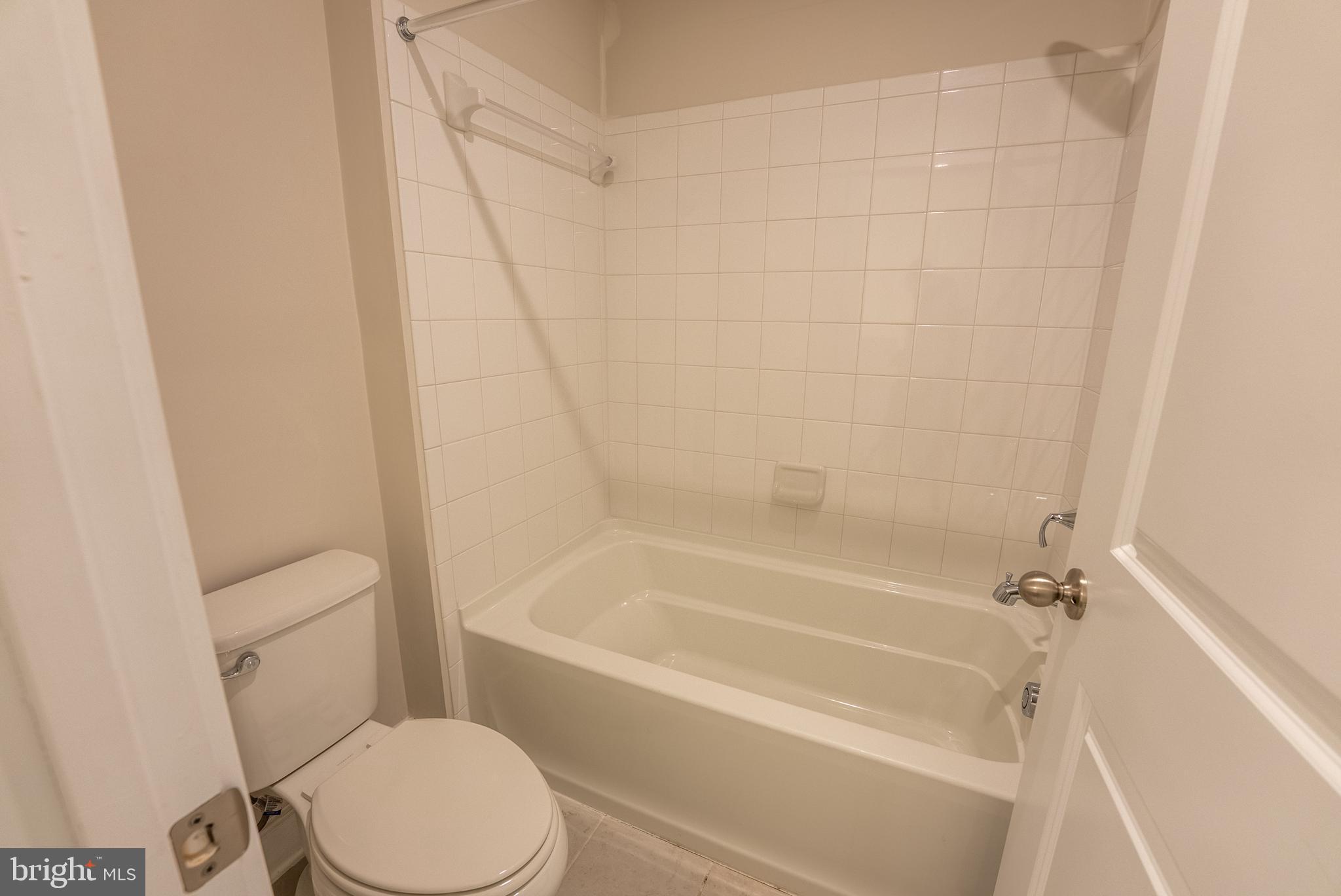 1622 Sandpiper Bay Loop Dumfries, VA 22026 - Photo 19 of 47 a white bath tub sitting next to a white toilet