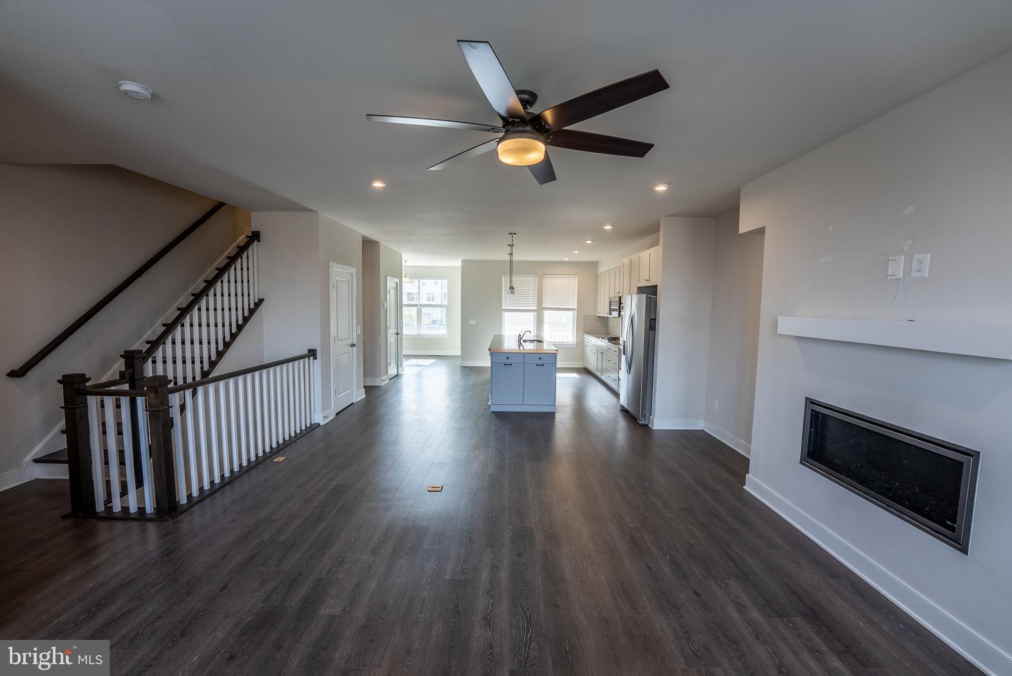 1622 Sandpiper Bay Loop Dumfries, VA 22026 - Photo 29 of 47 a view of a kitchen with wooden floor and a ceiling fan