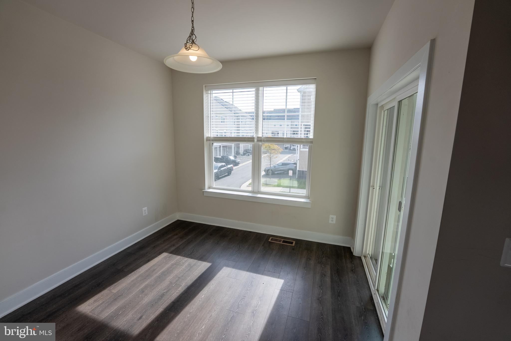 1622 Sandpiper Bay Loop Dumfries, VA 22026 - Photo 35 of 47 wooden floor in an empty room with a window
