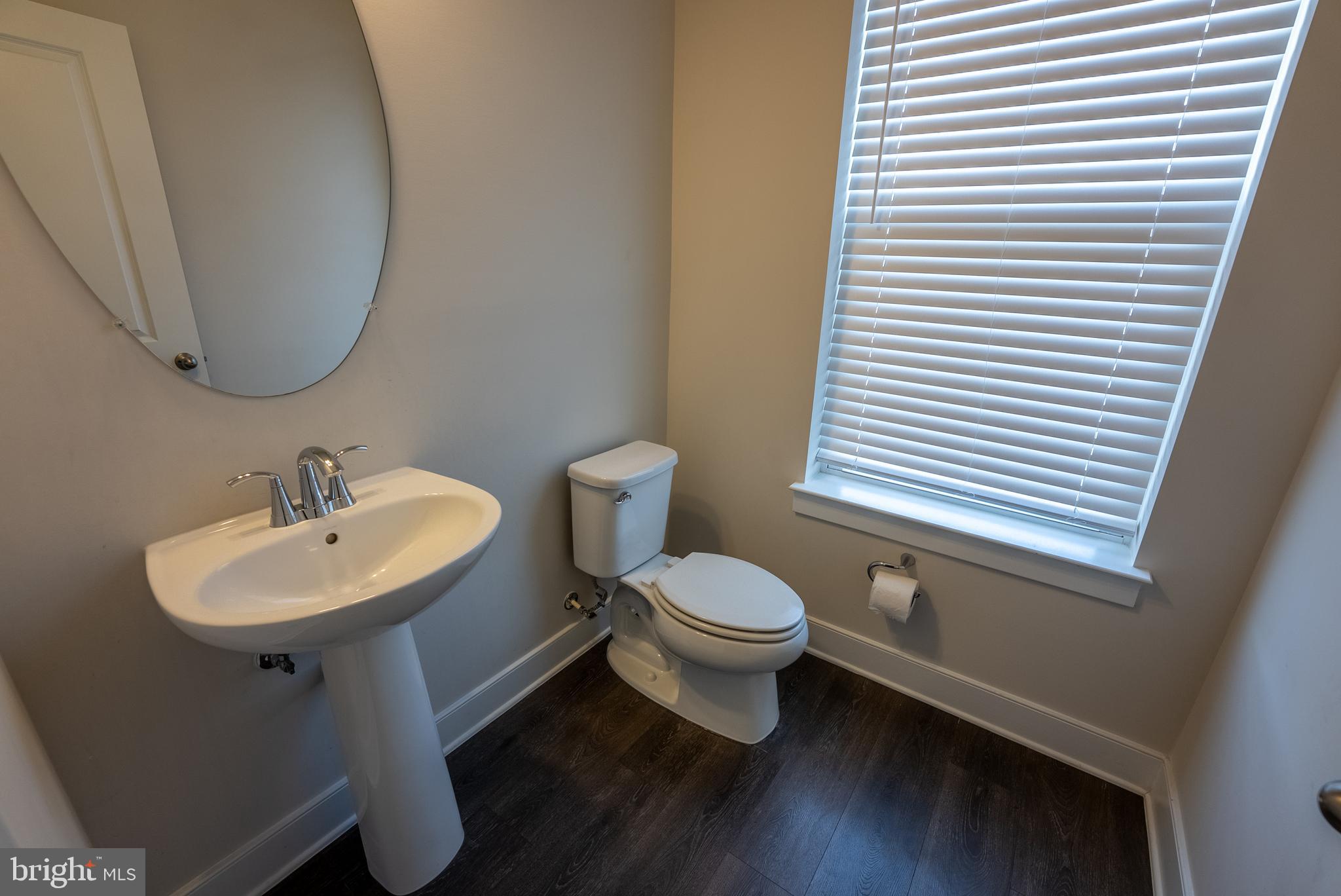 1622 Sandpiper Bay Loop Dumfries, VA 22026 - Photo 7 of 47 a bathroom with a toilet a sink and a mirror