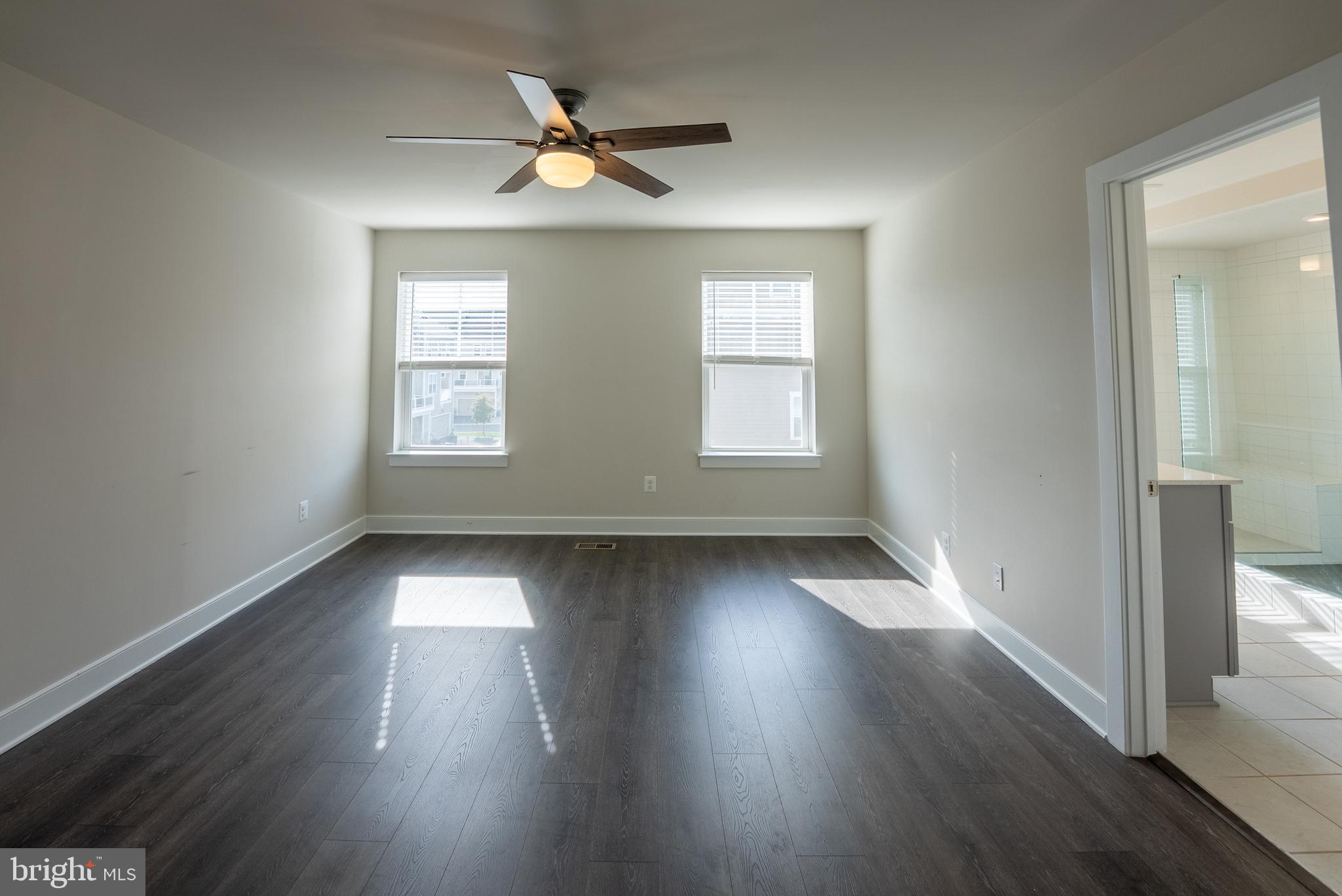 1622 Sandpiper Bay Loop Dumfries, VA 22026 - Photo 8 of 47 an empty room with wooden floor and windows