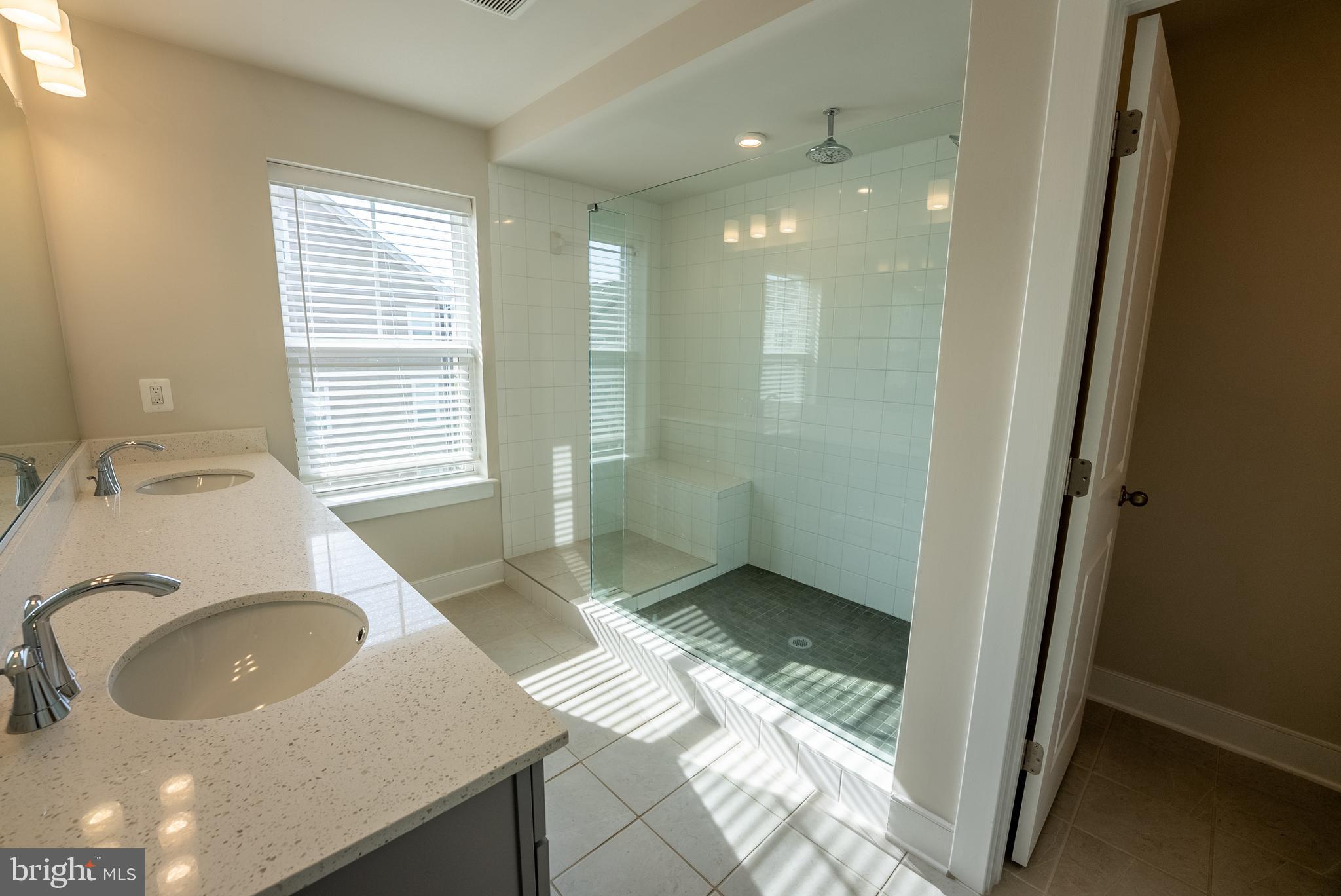 1622 Sandpiper Bay Loop Dumfries, VA 22026 - Photo 10 of 47 a bathroom with a sink and a mirror