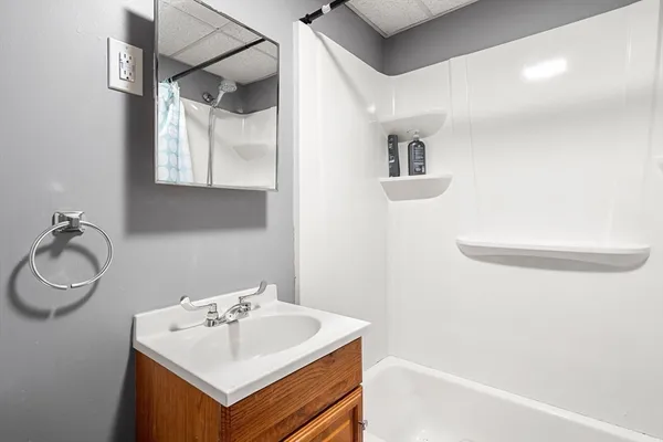a bathroom with a sink and a mirror