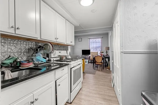 a kitchen with a sink and cabinets