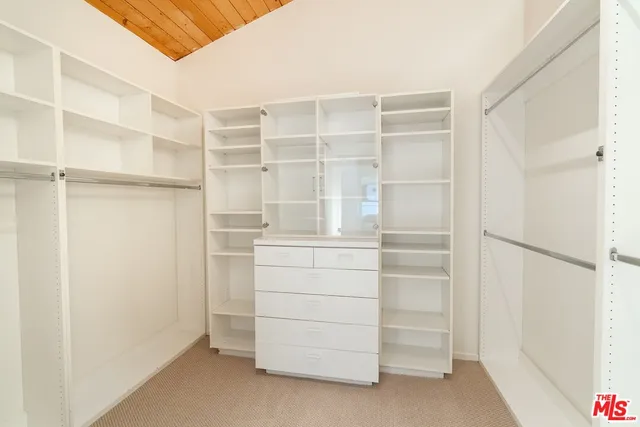 a view of an empty walk in closet