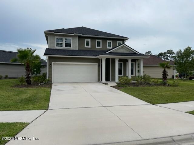 2218 Eagle Talon Circle Fleming Island, FL 32003 - Photo 1 of 40 front view of a house with a yard