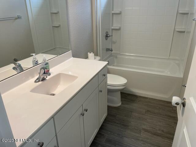 2218 Eagle Talon Circle Fleming Island, FL 32003 - Photo 13 of 40 a bathroom with a sink a toilet and shower