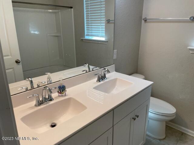 2218 Eagle Talon Circle Fleming Island, FL 32003 - Photo 14 of 40 a bathroom with a sink and a toilet