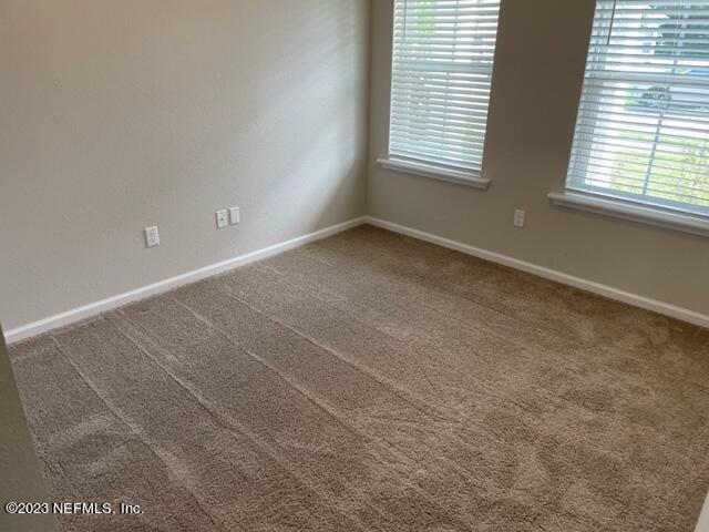2218 Eagle Talon Circle Fleming Island, FL 32003 - Photo 15 of 40 an empty room with windows