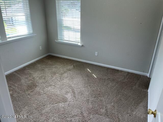 2218 Eagle Talon Circle Fleming Island, FL 32003 - Photo 16 of 40 an empty room with a window