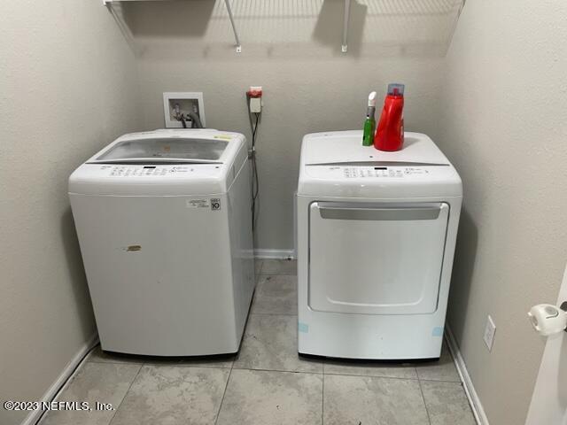 2218 Eagle Talon Circle Fleming Island, FL 32003 - Photo 17 of 40 a utility room with dryer and washer