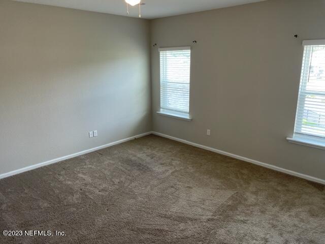 2218 Eagle Talon Circle Fleming Island, FL 32003 - Photo 18 of 40 an empty room with a window