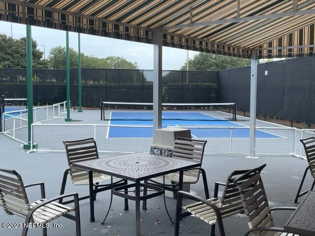 2218 Eagle Talon Circle Fleming Island, FL 32003 - Photo 25 of 40 a view of a chairs and table in the patio