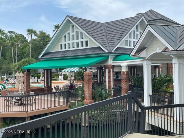 2218 Eagle Talon Circle Fleming Island, FL 32003 - Photo 26 of 40 a front view of a house with porch and wooden floor