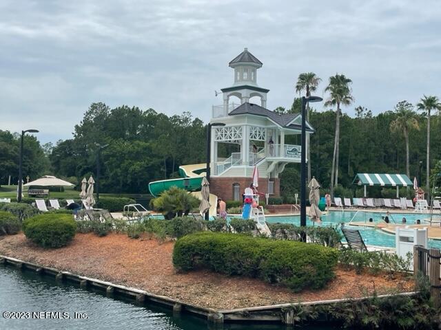 2218 Eagle Talon Circle Fleming Island, FL 32003 - Photo 28 of 40 a view of a house with a yard and potted plants