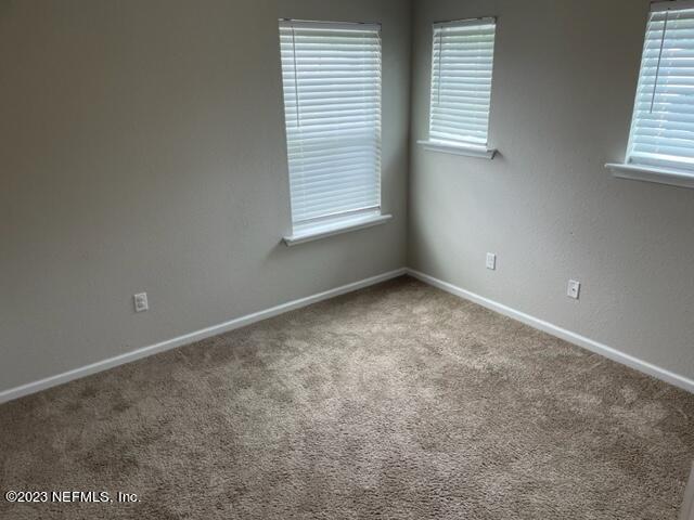 2218 Eagle Talon Circle Fleming Island, FL 32003 - Photo 38 of 40 an empty room with windows