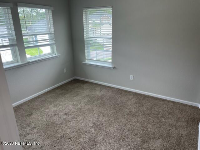 2218 Eagle Talon Circle Fleming Island, FL 32003 - Photo 39 of 40 an empty room with windows