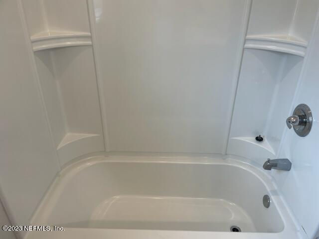 2218 Eagle Talon Circle Fleming Island, FL 32003 - Photo 40 of 40 a close up of a bathtub in a bathroom