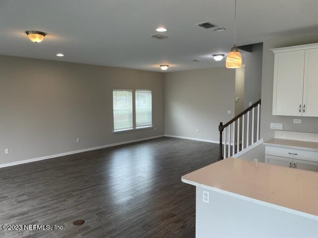 2218 Eagle Talon Circle Fleming Island, FL 32003 - Photo 6 of 40 wooden floor in an empty room with a window