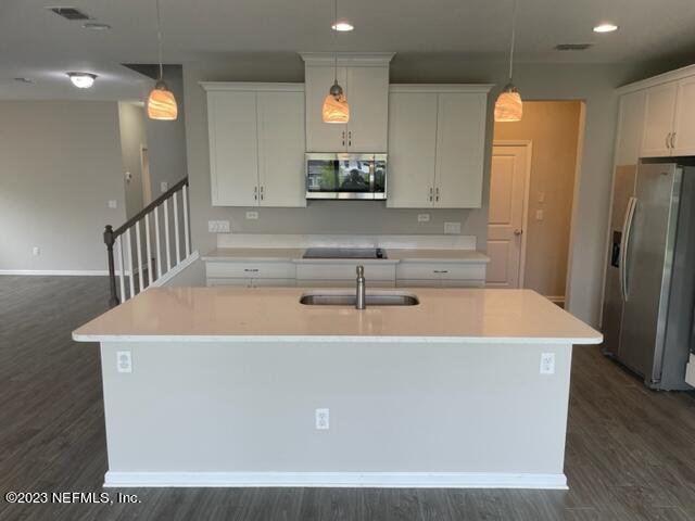 2218 Eagle Talon Circle Fleming Island, FL 32003 - Photo 8 of 40 a view of kitchen with stainless steel appliances granite countertop refrigerator sink and stove