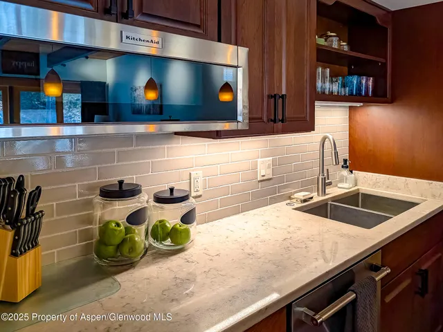 a kitchen with a sink and a microwave