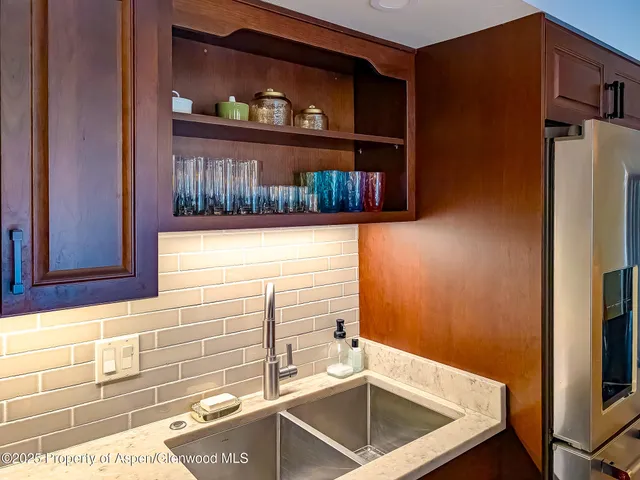 a bathroom with a window and a cabinet