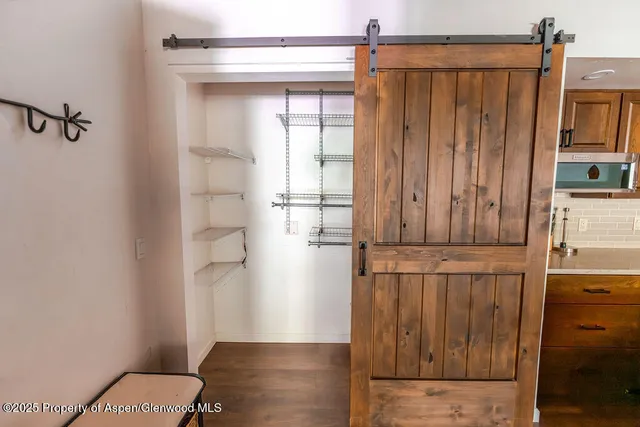 a utility room with washing machine