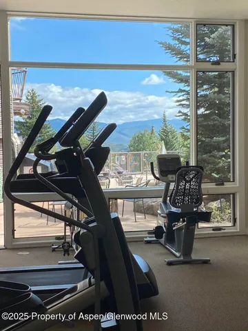 a view of a kitchen with furniture and window