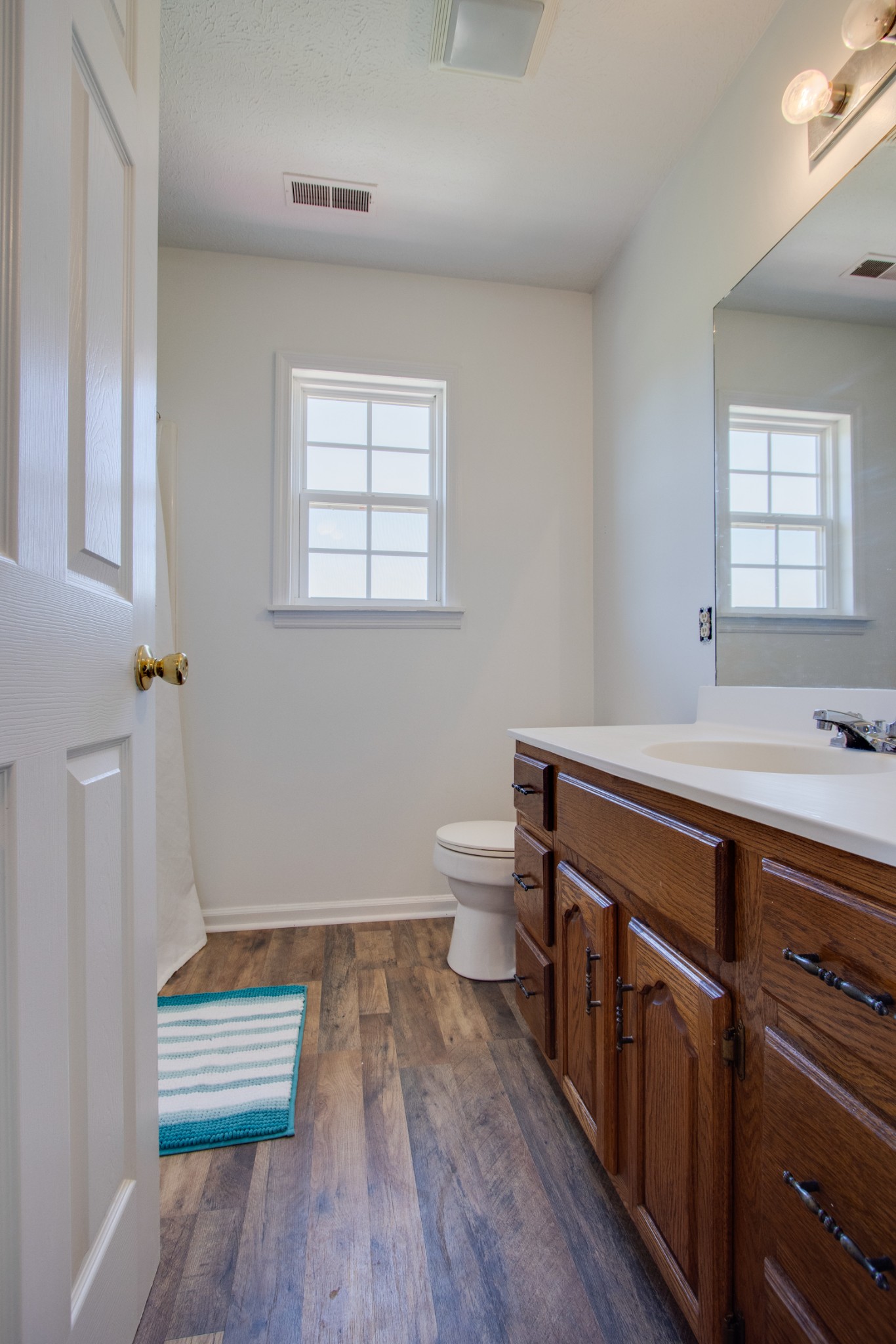 144 Roberts Road Portland, TN 37148 - Photo 22 of 24 a bathroom with a sink a toilet and a window