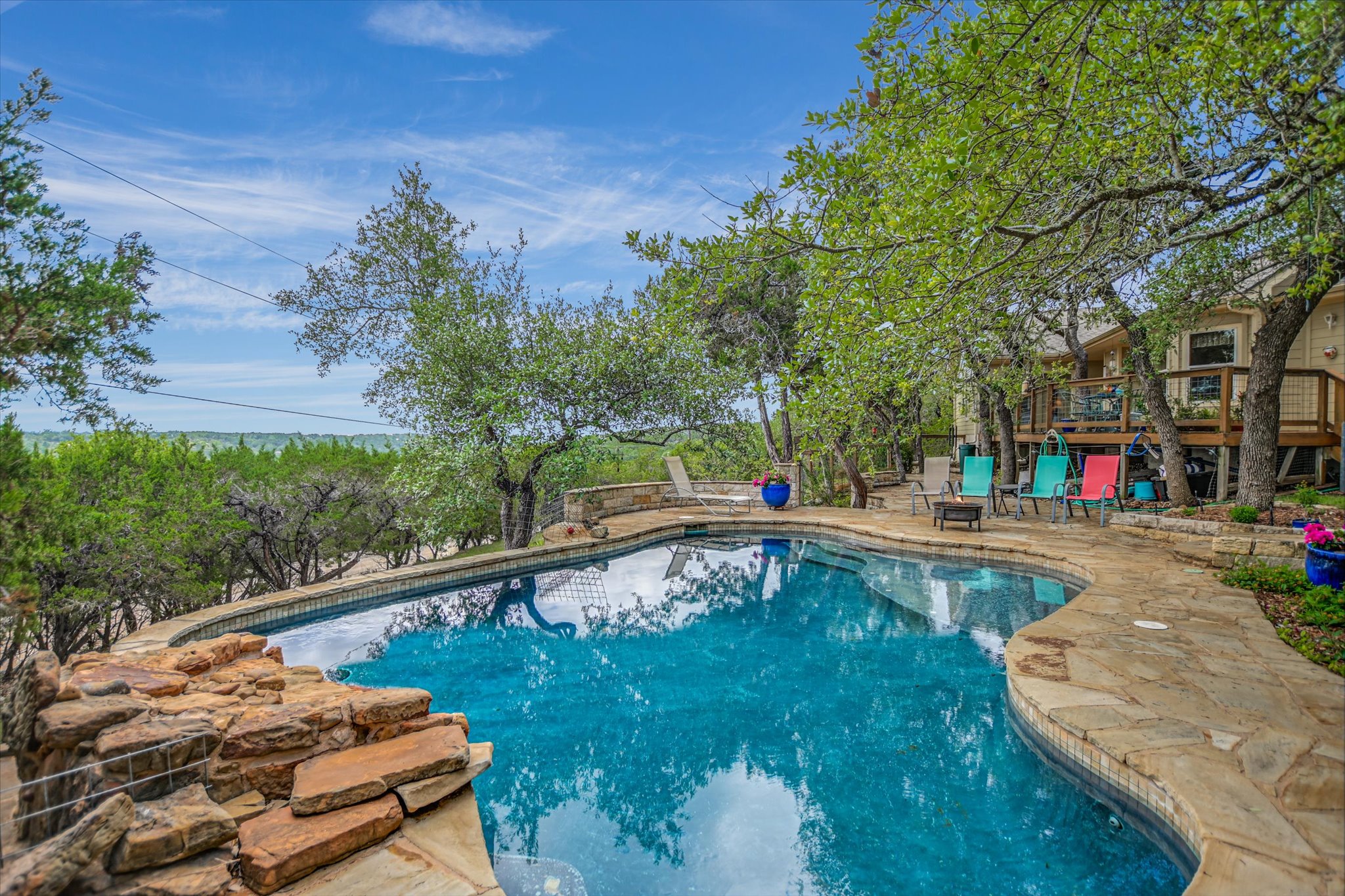 590 Rancho Grande Drive Wimberley, TX 78676 - Photo 26 of 30 a view of a swimming pool with a patio
