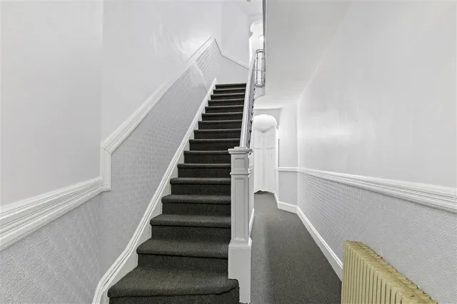 a picture of a table and a vase of flowers