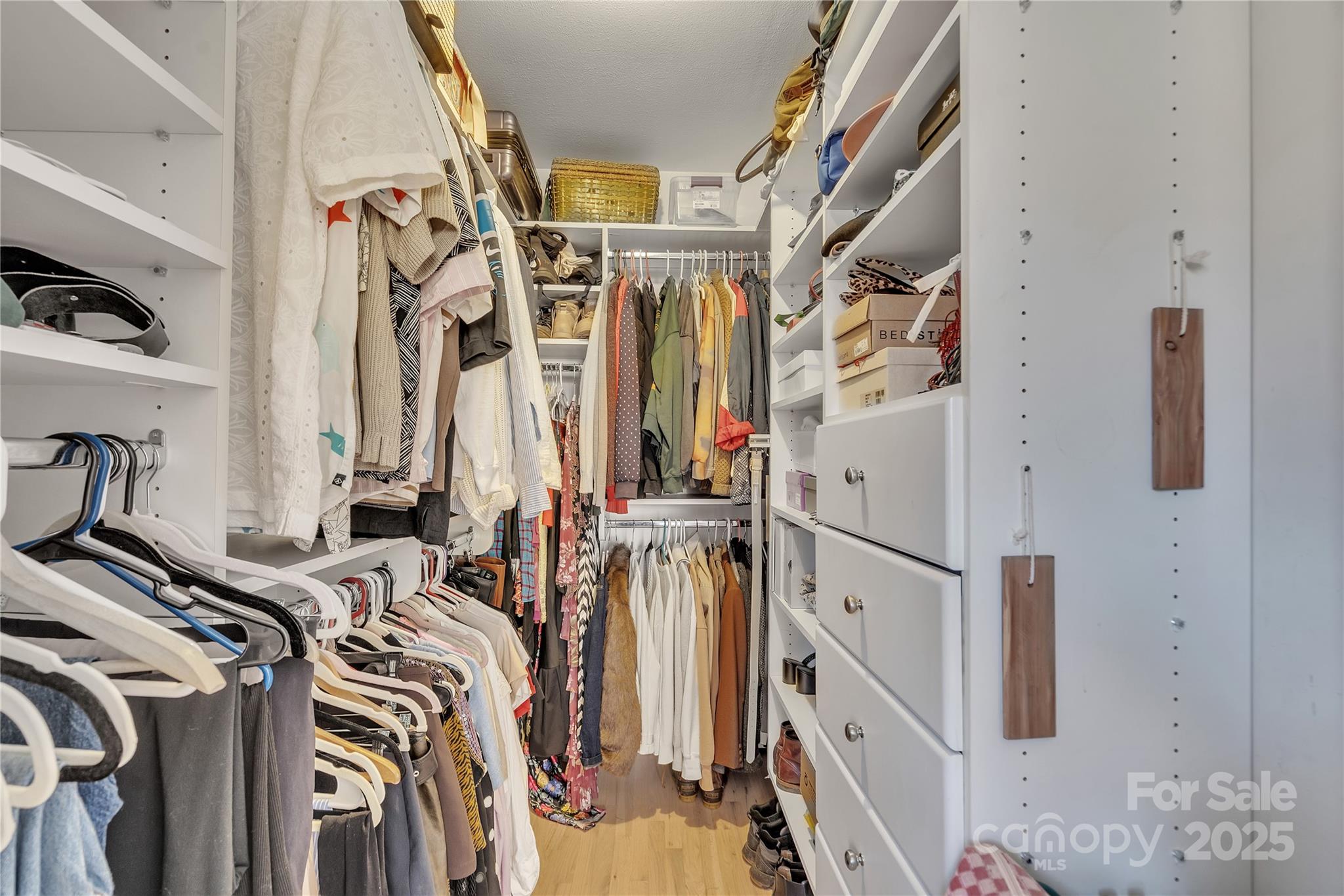 35 Wilcox Road Tryon, NC 28782 - Photo 16 of 24 a view of walk in closet with clothes and shoes