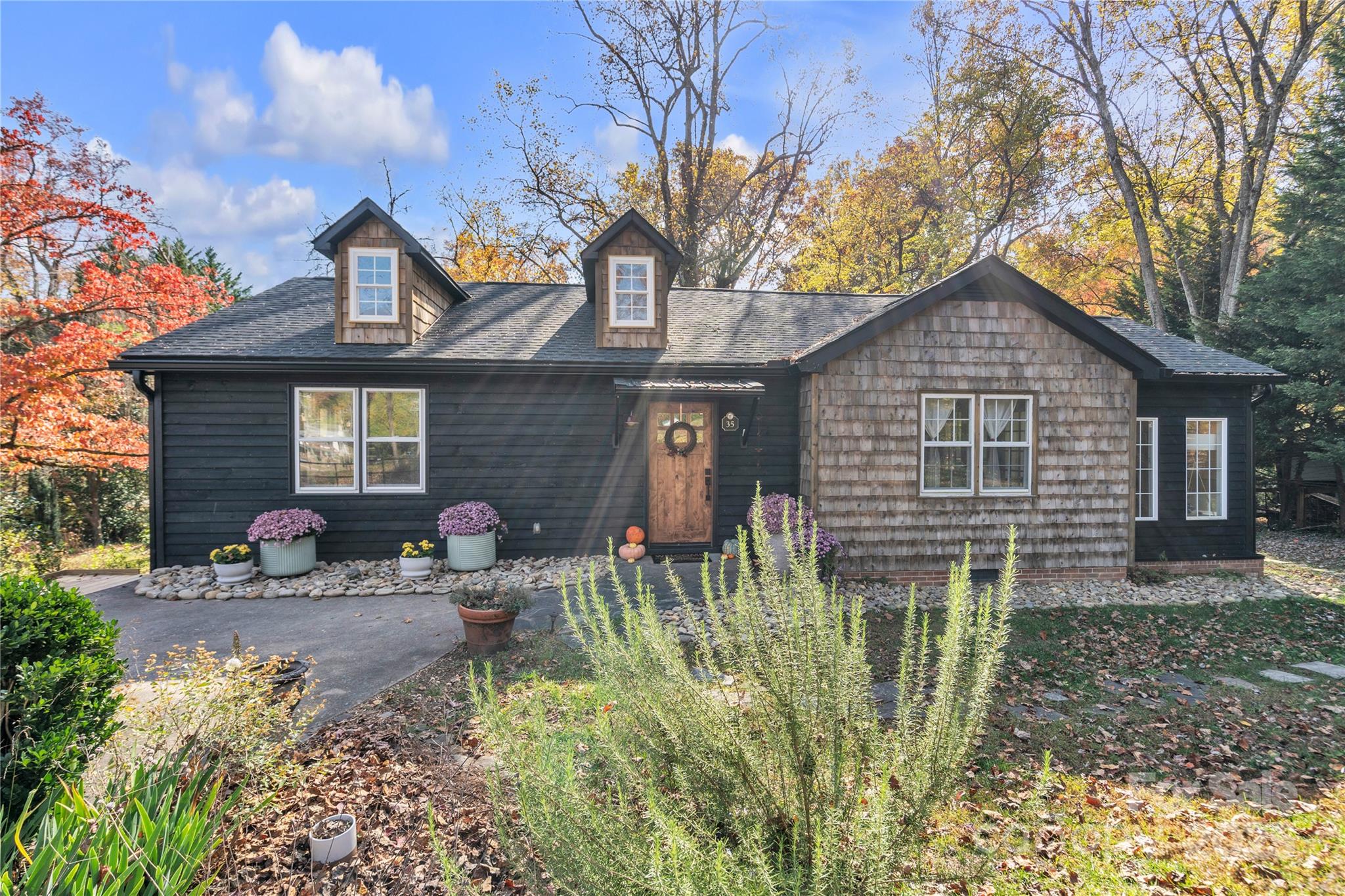 35 Wilcox Road Tryon, NC 28782 - Photo 3 of 24 a front view of a house with garden