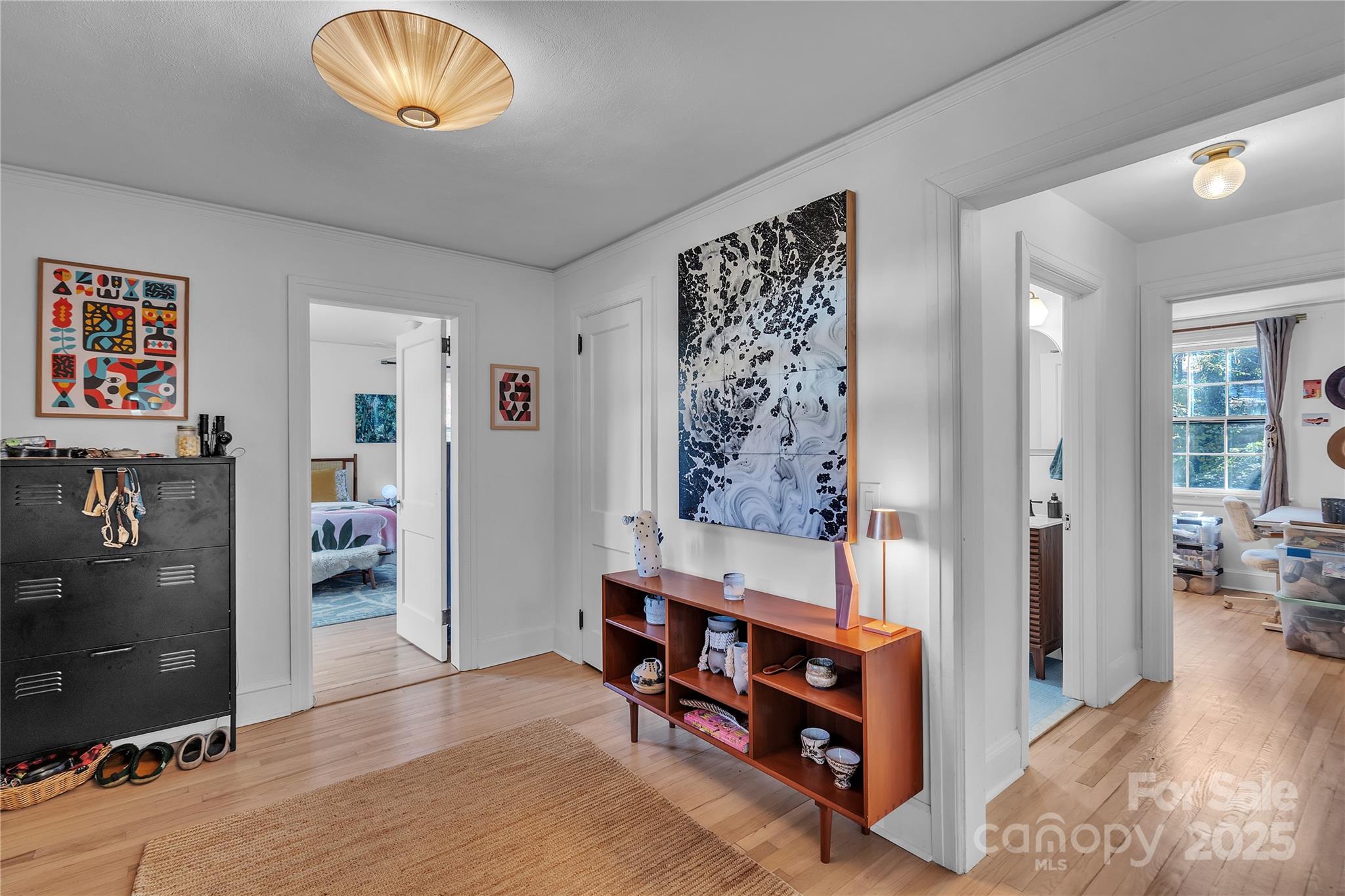 35 Wilcox Road Tryon, NC 28782 - Photo 5 of 24 a view of a bedroom with workspace and natural light