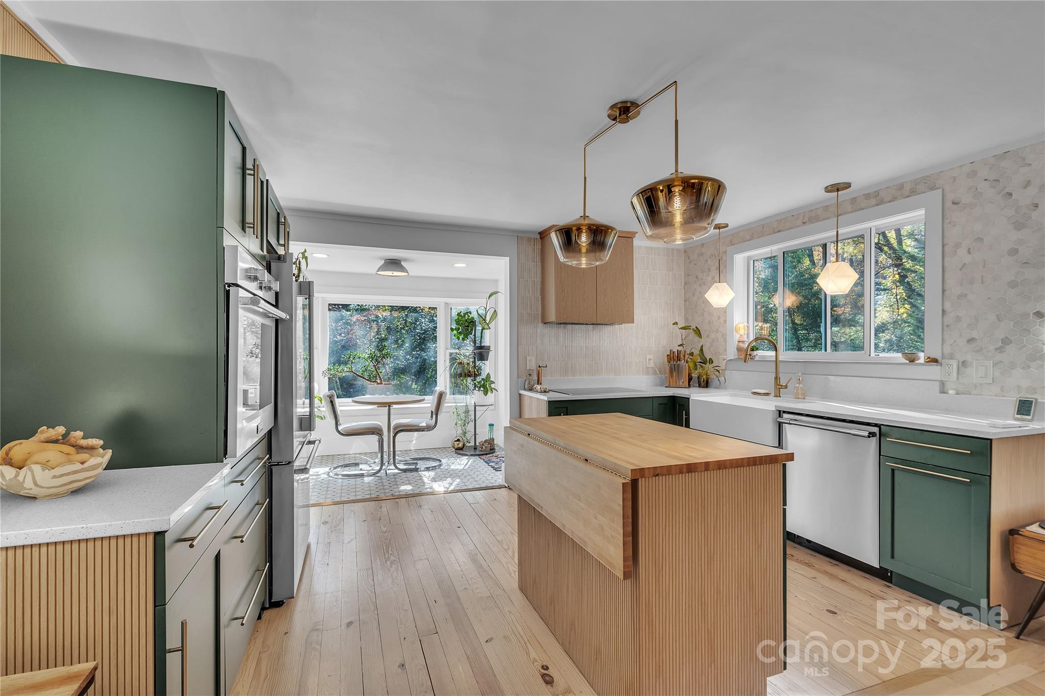35 Wilcox Road Tryon, NC 28782 - Photo 8 of 24 a kitchen that has a sink a stove and a wooden floor
