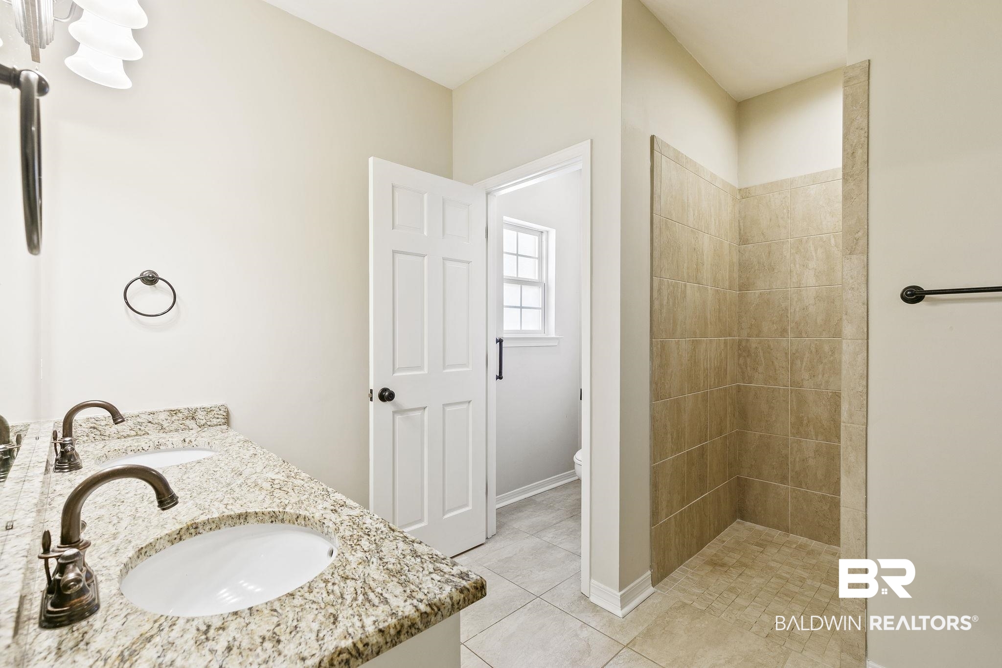 9631 Bay Meadows Avenue Fairhope, AL 36532 - Photo 20 of 49 Bathroom featuring tile patterned floors, double vanity, tiled shower, and toilet room.