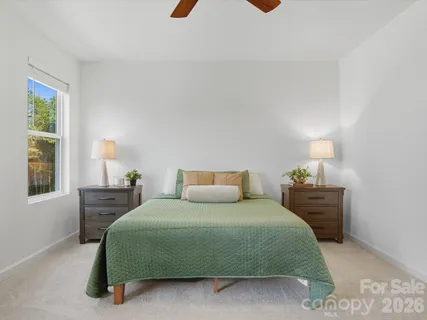 a bedroom with a bed and window