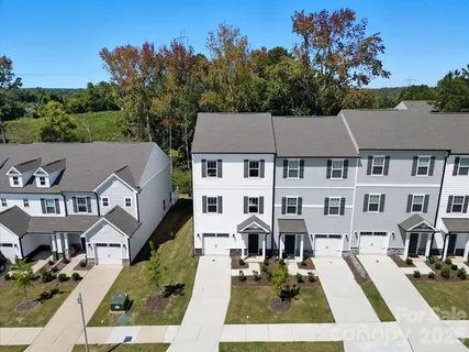 an aerial view of residential houses and trees