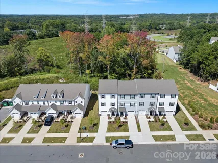 an aerial view of a house with a ocean view
