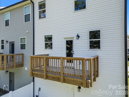 a view of a brick house with a large windows