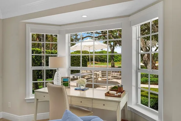 a spacious bedroom with two beds and a window