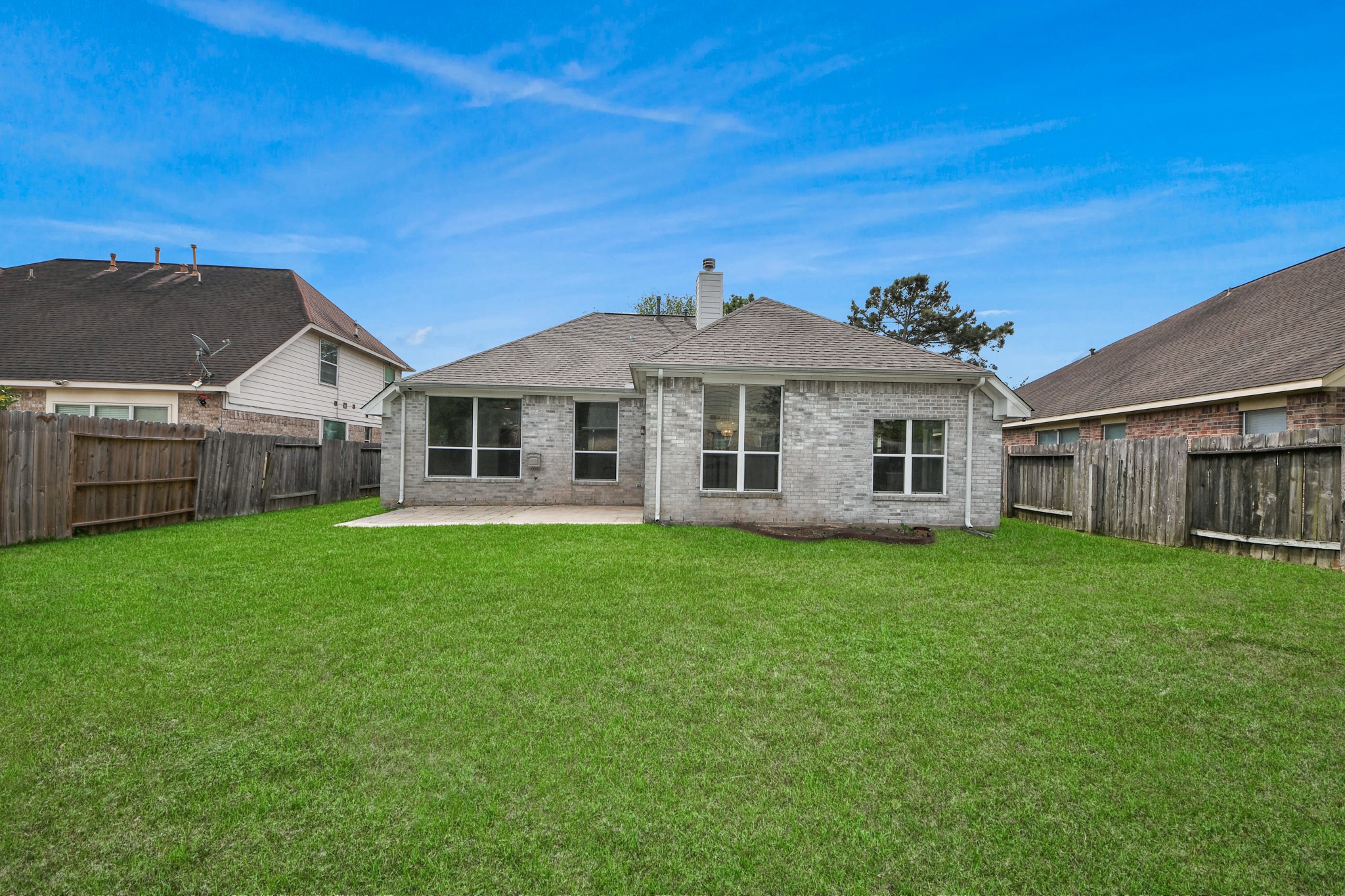 14423 Gadwall Court Houston, TX 77044 - Photo 42 of 42 a view of a yard in front of a house with a large tree
