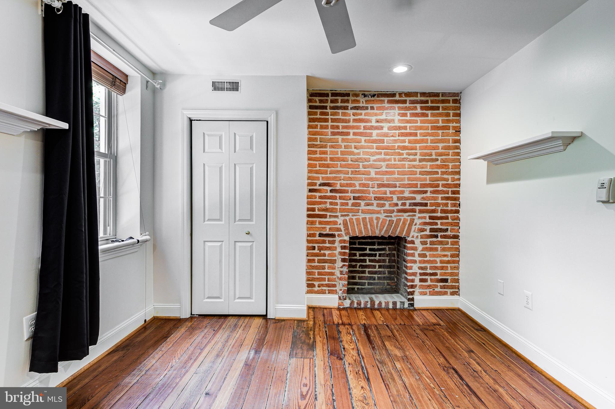 1120 Riverside Avenue Baltimore, MD 21230 - Photo 32 of 40 2nd level front bedroom 3 w/ decorative fireplace