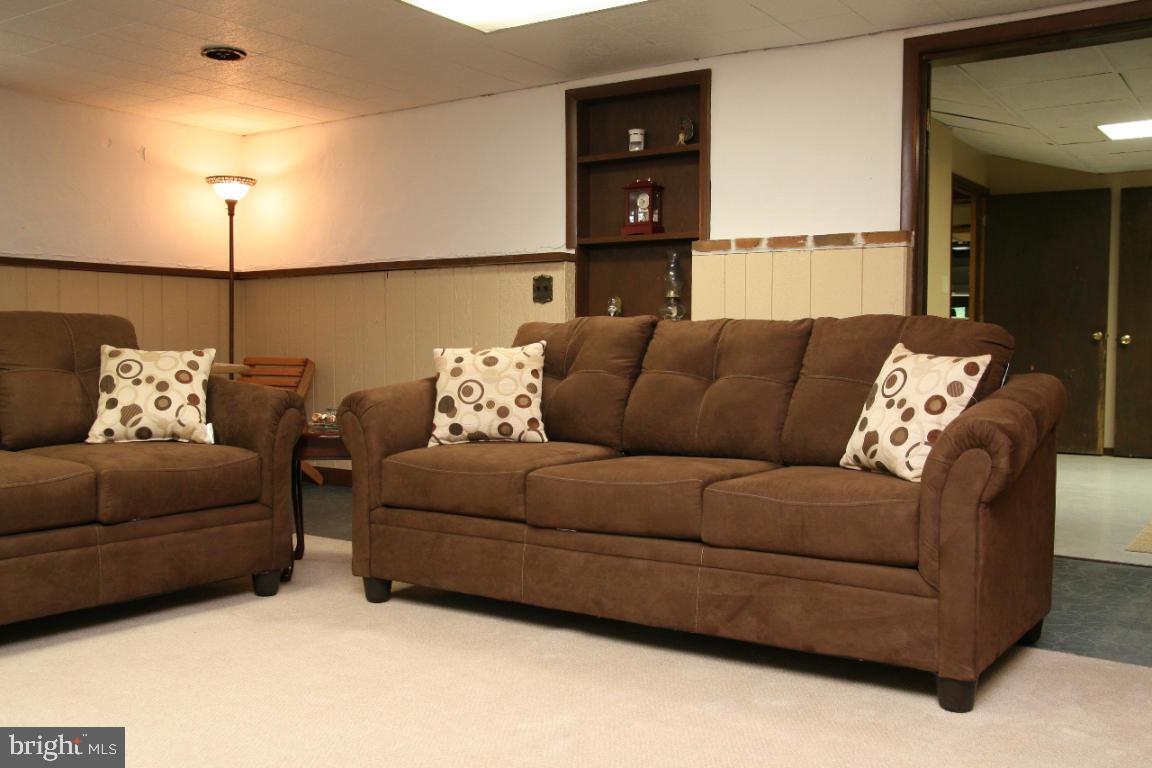 3162 A Pinch Road Manheim, PA 17545 - Photo 11 of 13 a living room with furniture and a lamp