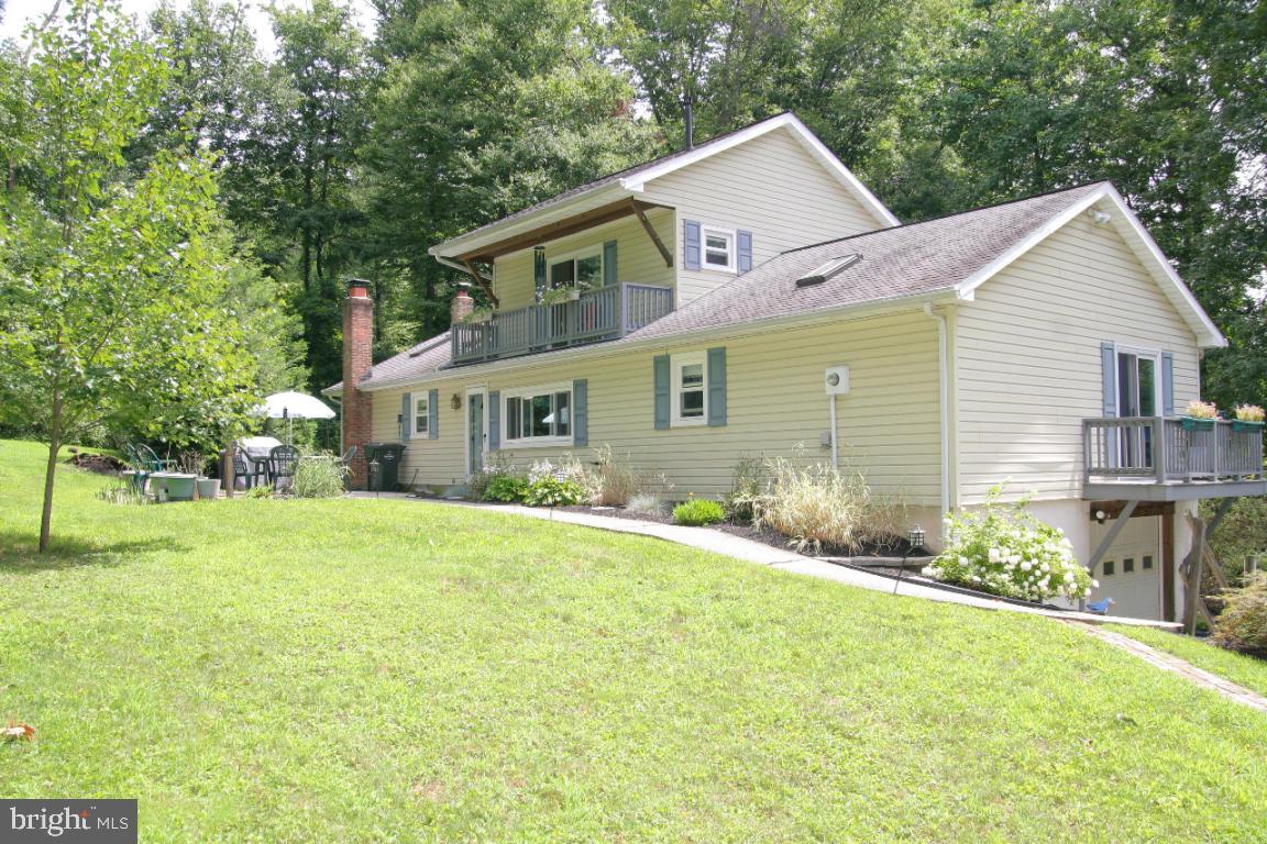 3162 A Pinch Road Manheim, PA 17545 - Photo 12 of 13 a front view of a house with a yard and garage