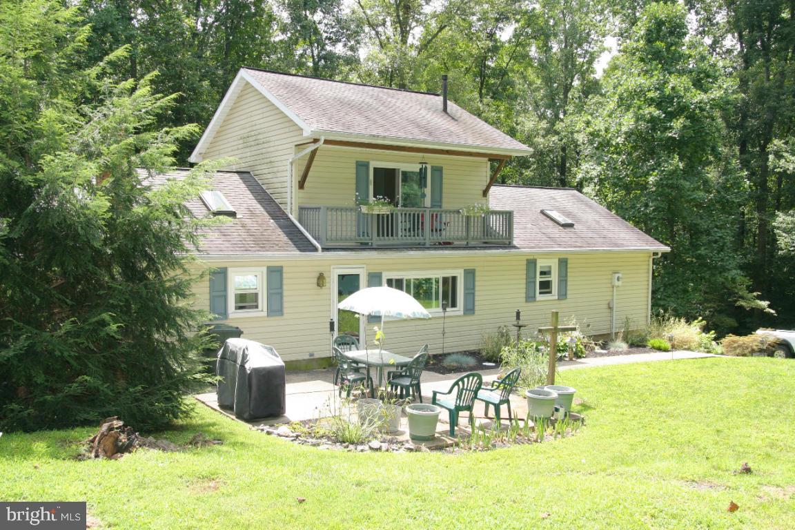 3162 A Pinch Road Manheim, PA 17545 - Photo 13 of 13 a front view of a house with swimming pool table and chairs