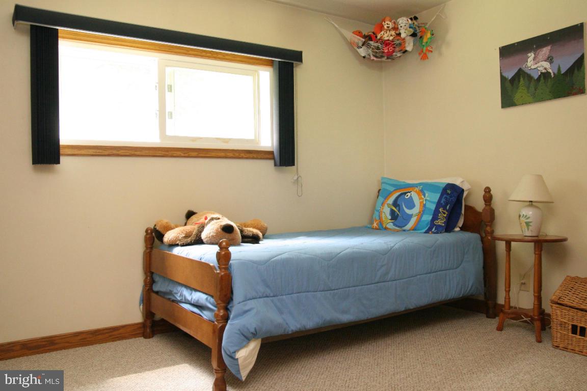 3162 A Pinch Road Manheim, PA 17545 - Photo 6 of 13 a bedroom with a bed and a window