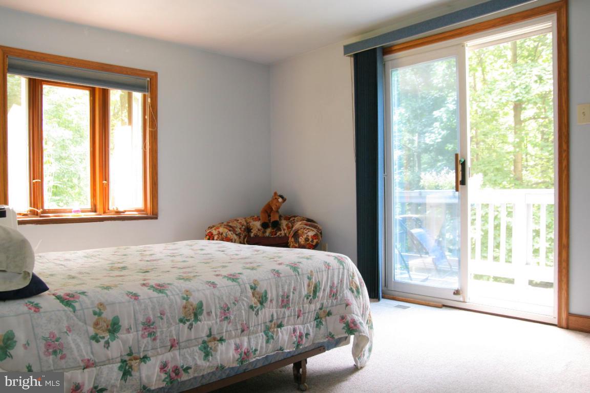 3162 A Pinch Road Manheim, PA 17545 - Photo 7 of 13 a bedroom with a bed and a large window