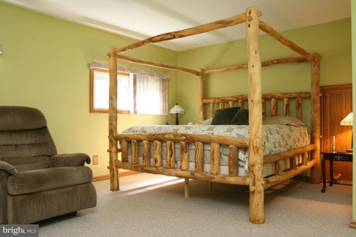 3162 A Pinch Road Manheim, PA 17545 - Photo 8 of 13 a bedroom with a bed and a couch
