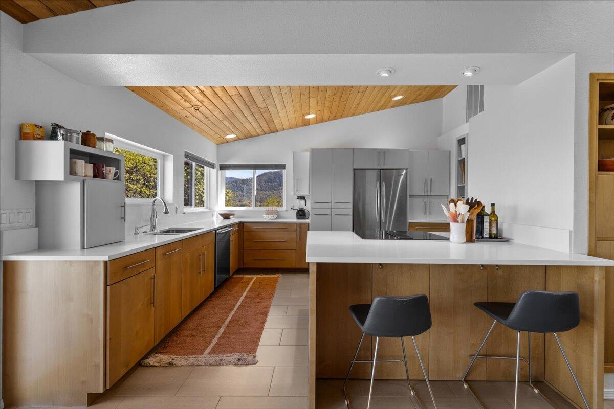 5229 Pioneer Road Medford, OR 97501 - Photo 21 of 62 Kitchen features bar seating.